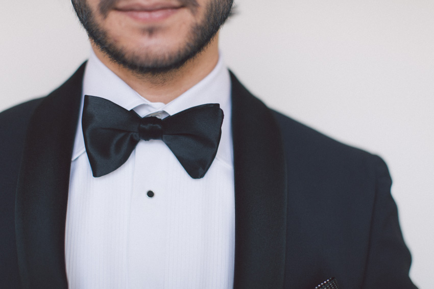 groom wearing bow tie
