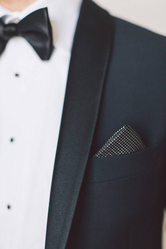 groom with silver pocket square
