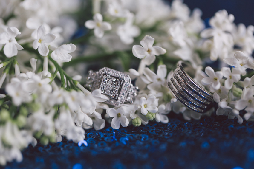bride's diamon engagement ring in white flowers