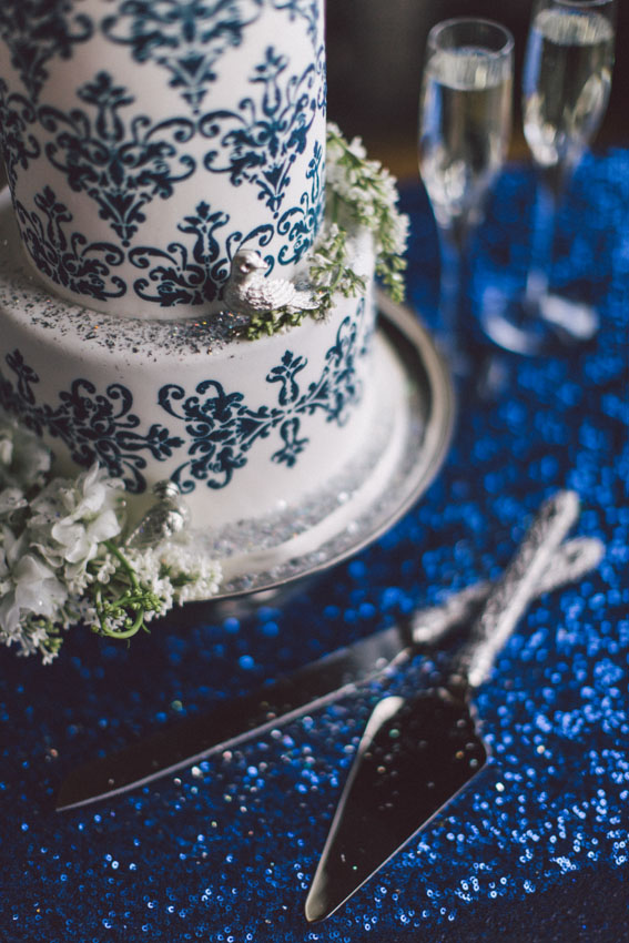 sparkle blue table cloth and wedding cake knives