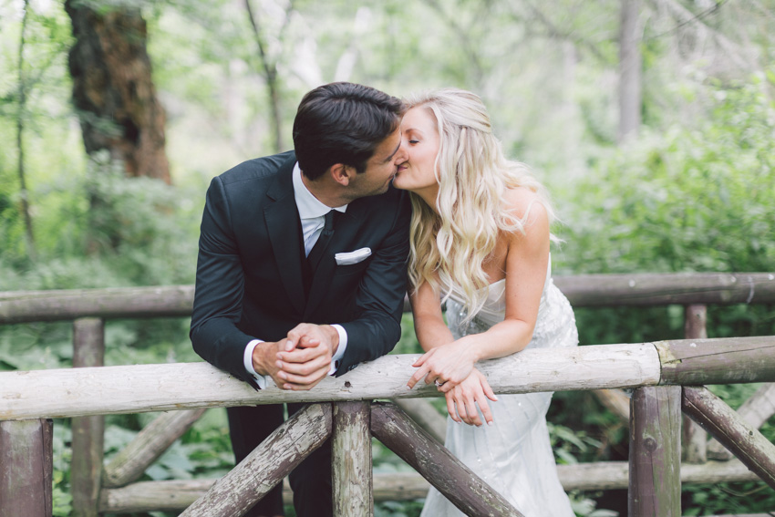 bride and groom kiss