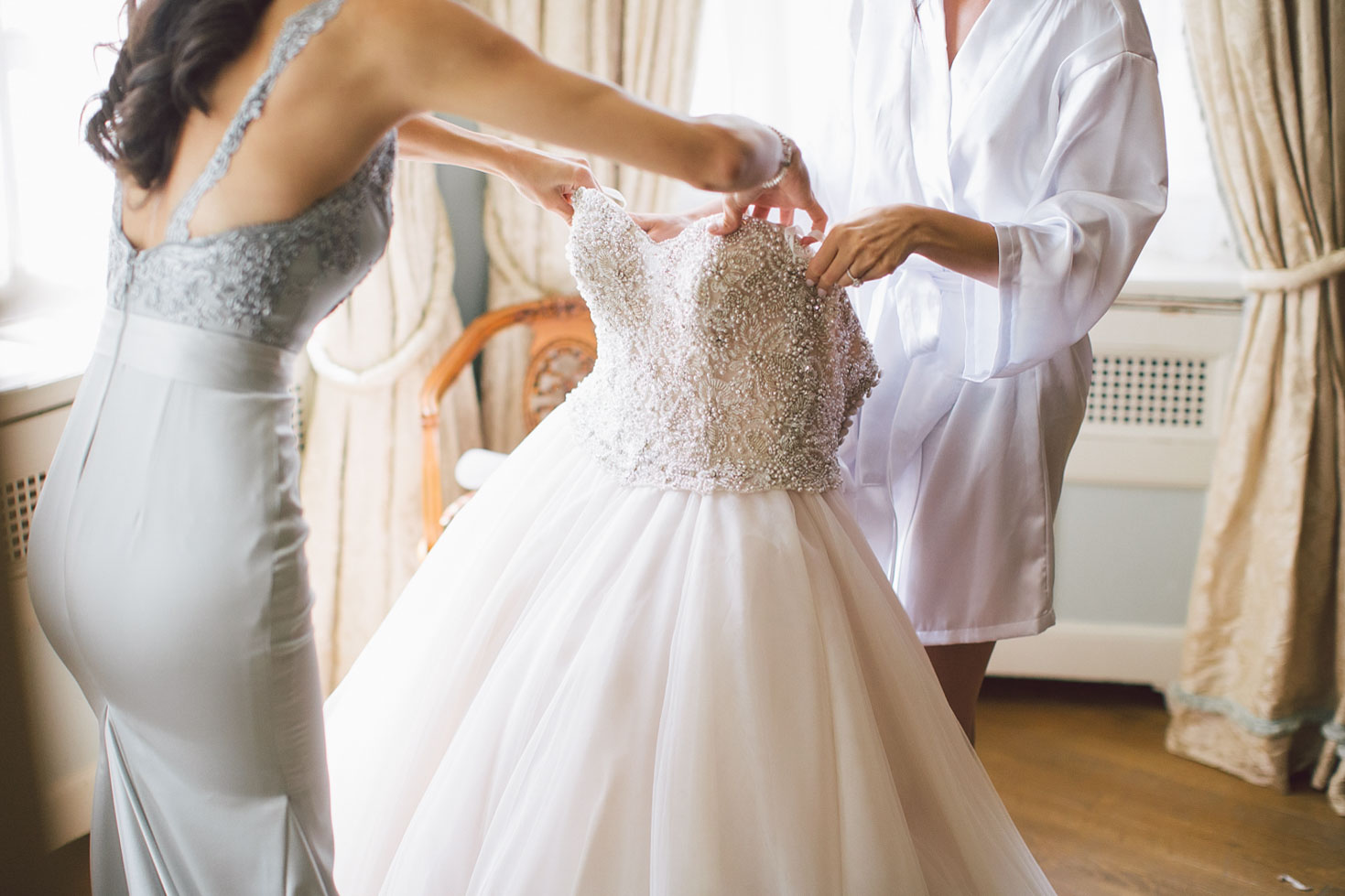 putting wedding dress on