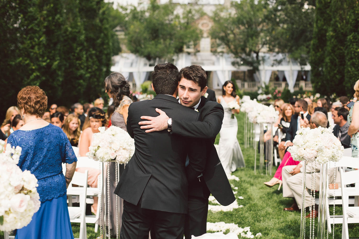 best man hugging groom
