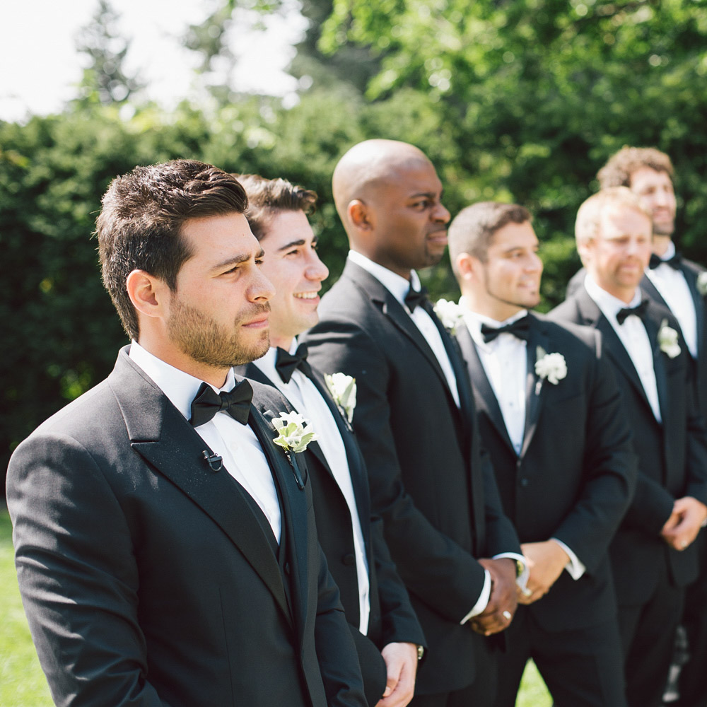 groom standing down the aisle