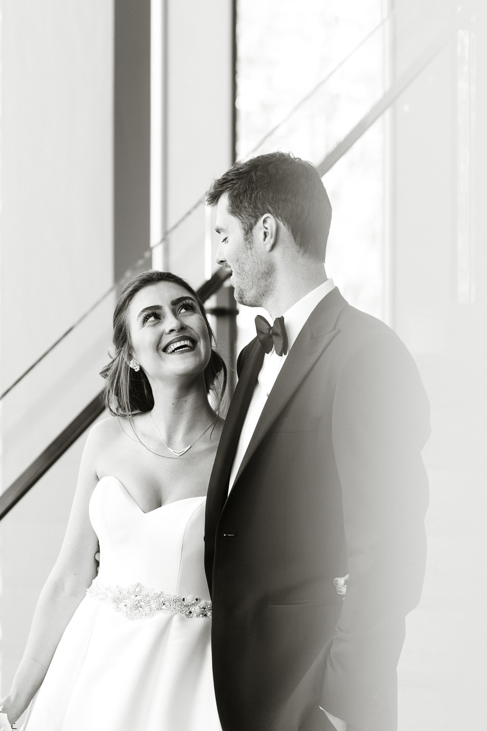 bride and groom by staircase