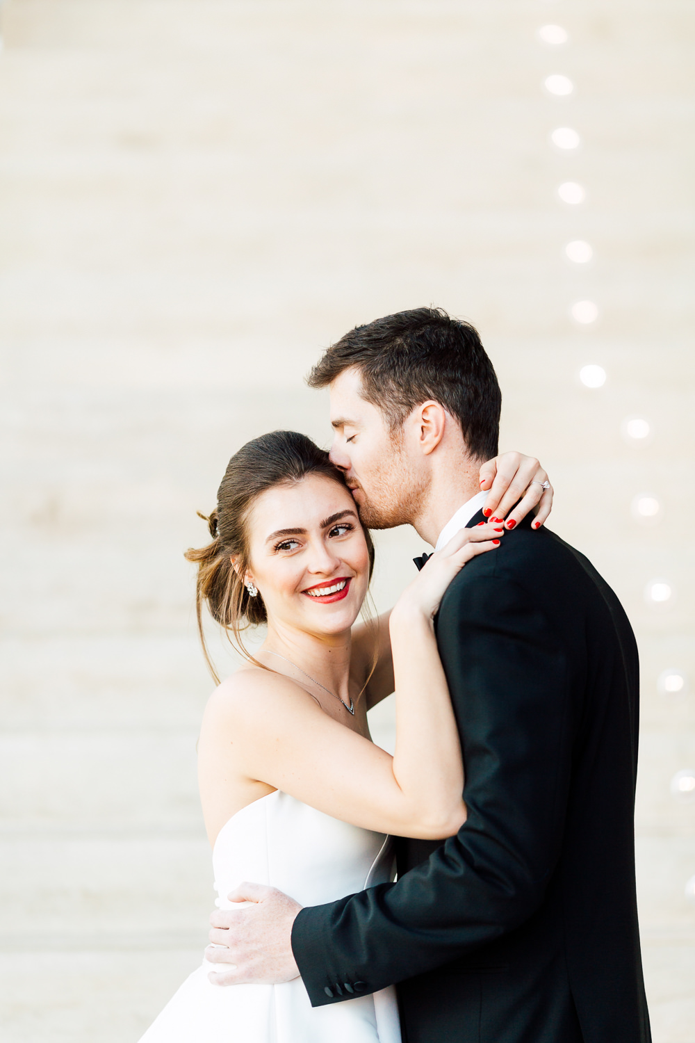 bride and groom by staircase