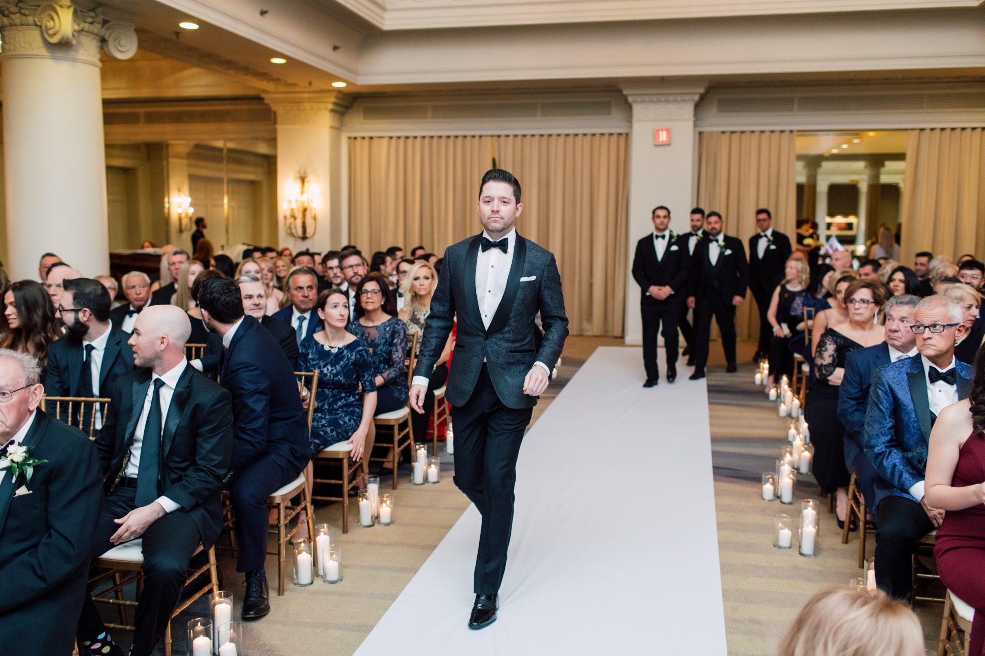 groom walking down aisle