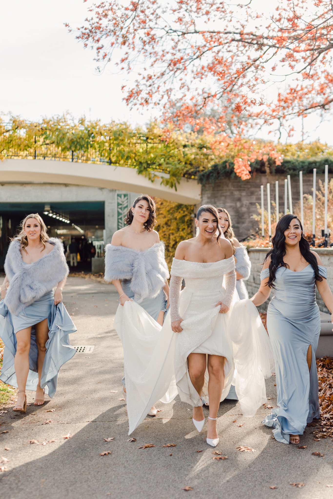 bride walking with bridesmaids
