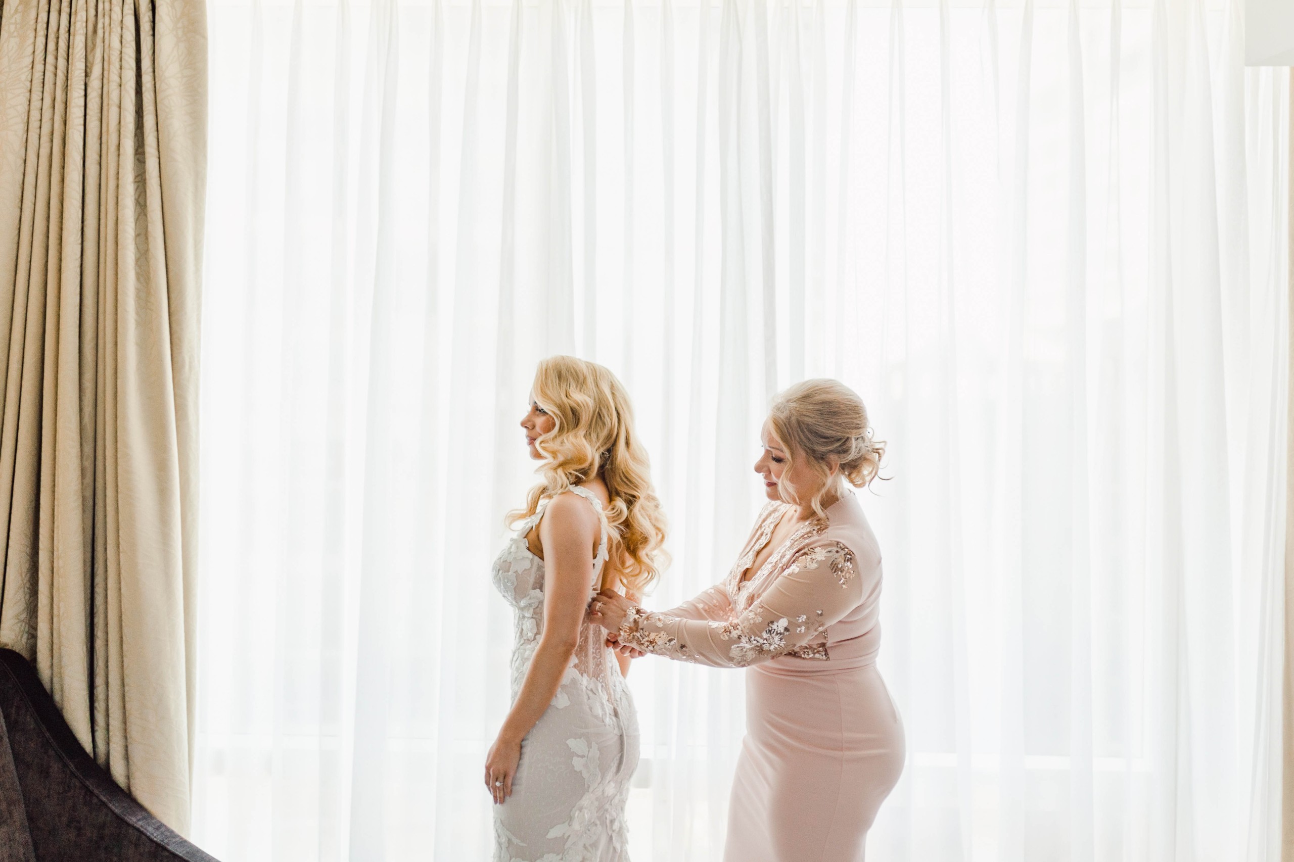 Bride Getting Ready in dress with mother at the Shangri-La Hotel