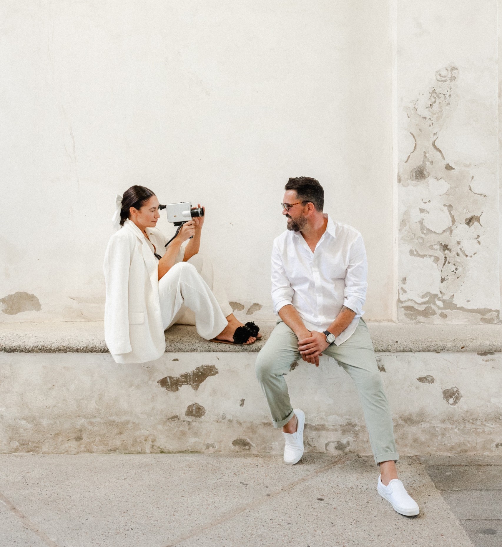 Couple shooting with an vintage camera.