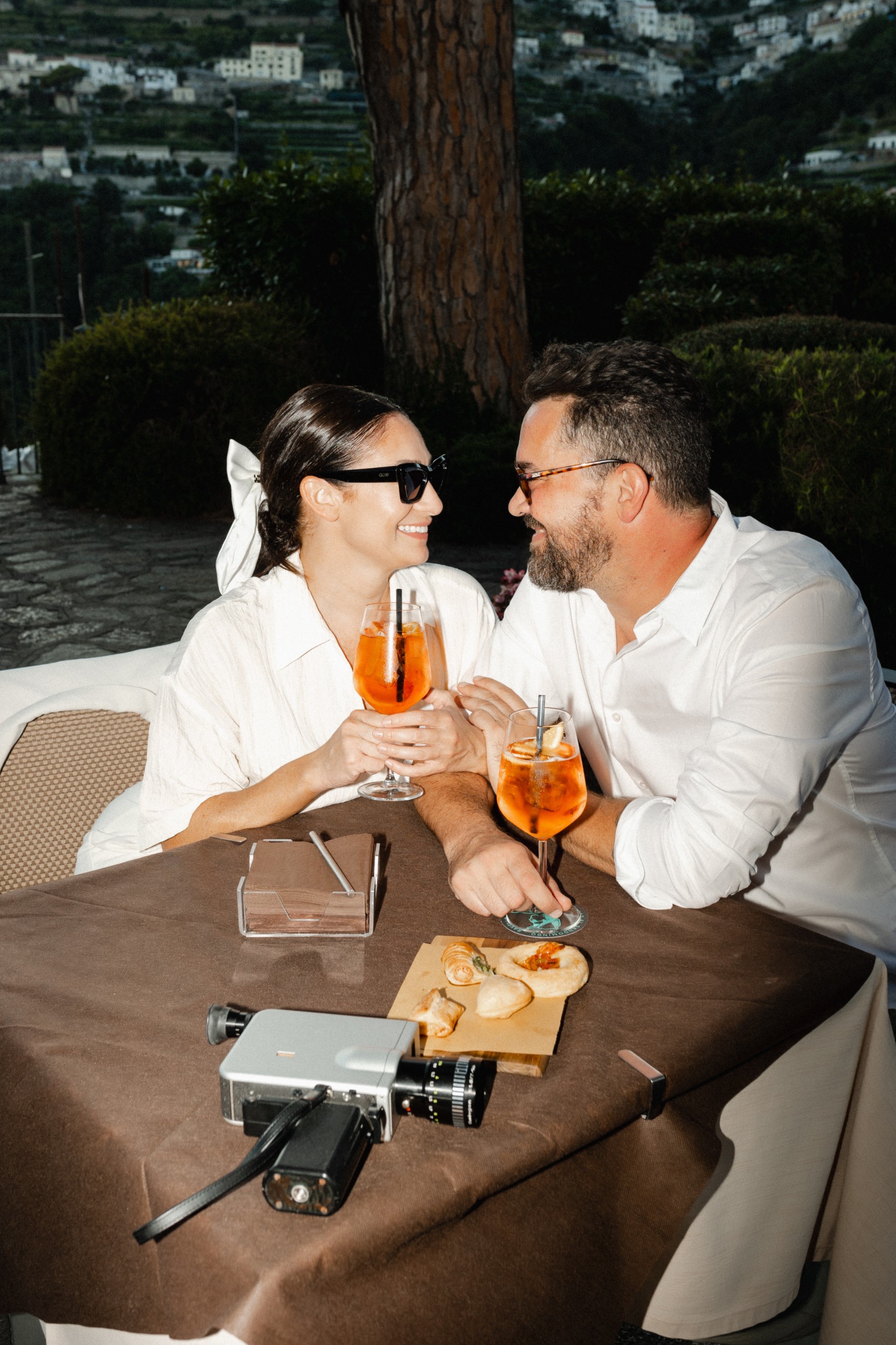Couple enjoying Aperol Spritz at a Italian Café