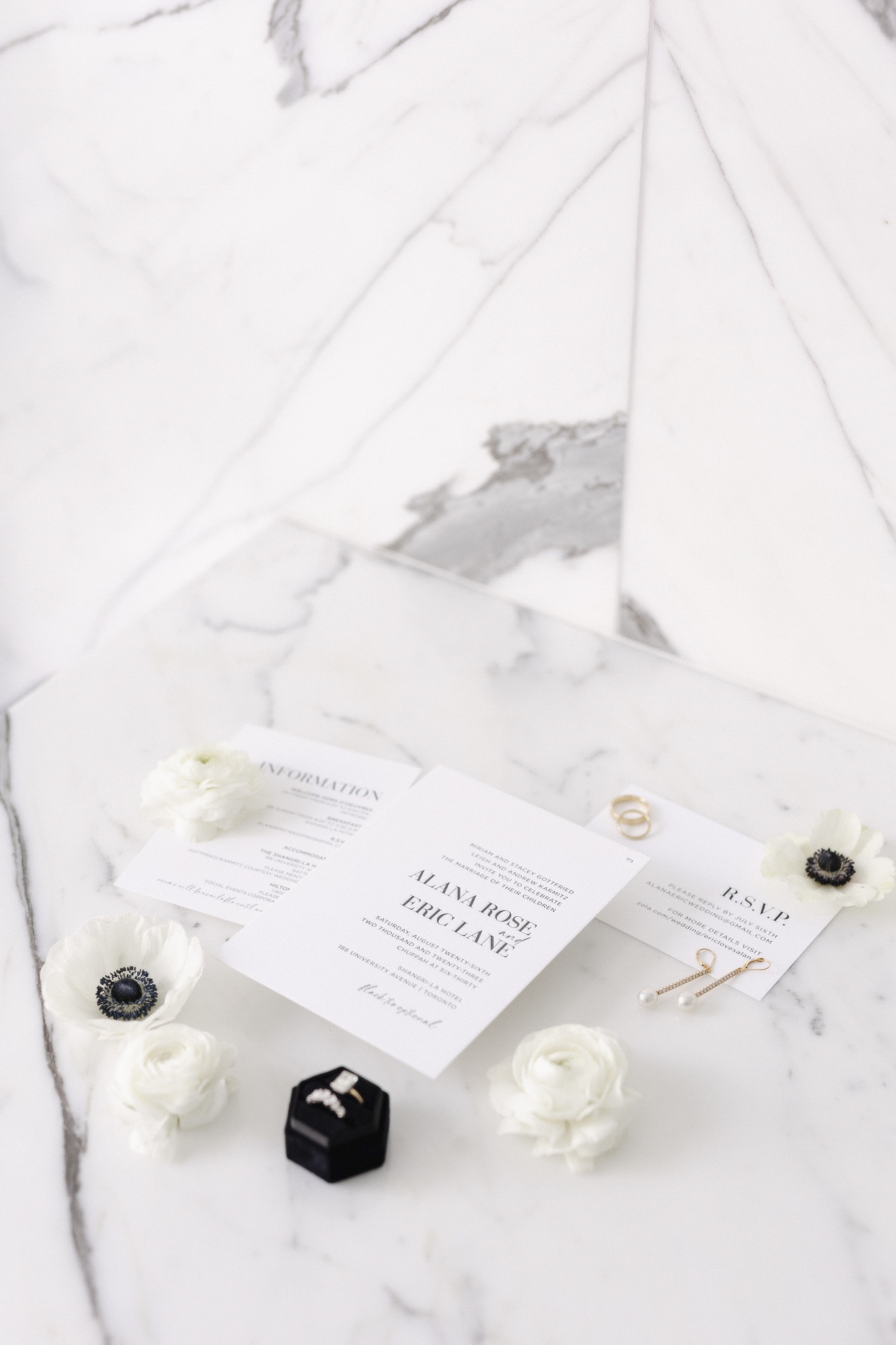a wedding invitation cards and flowers, side angle