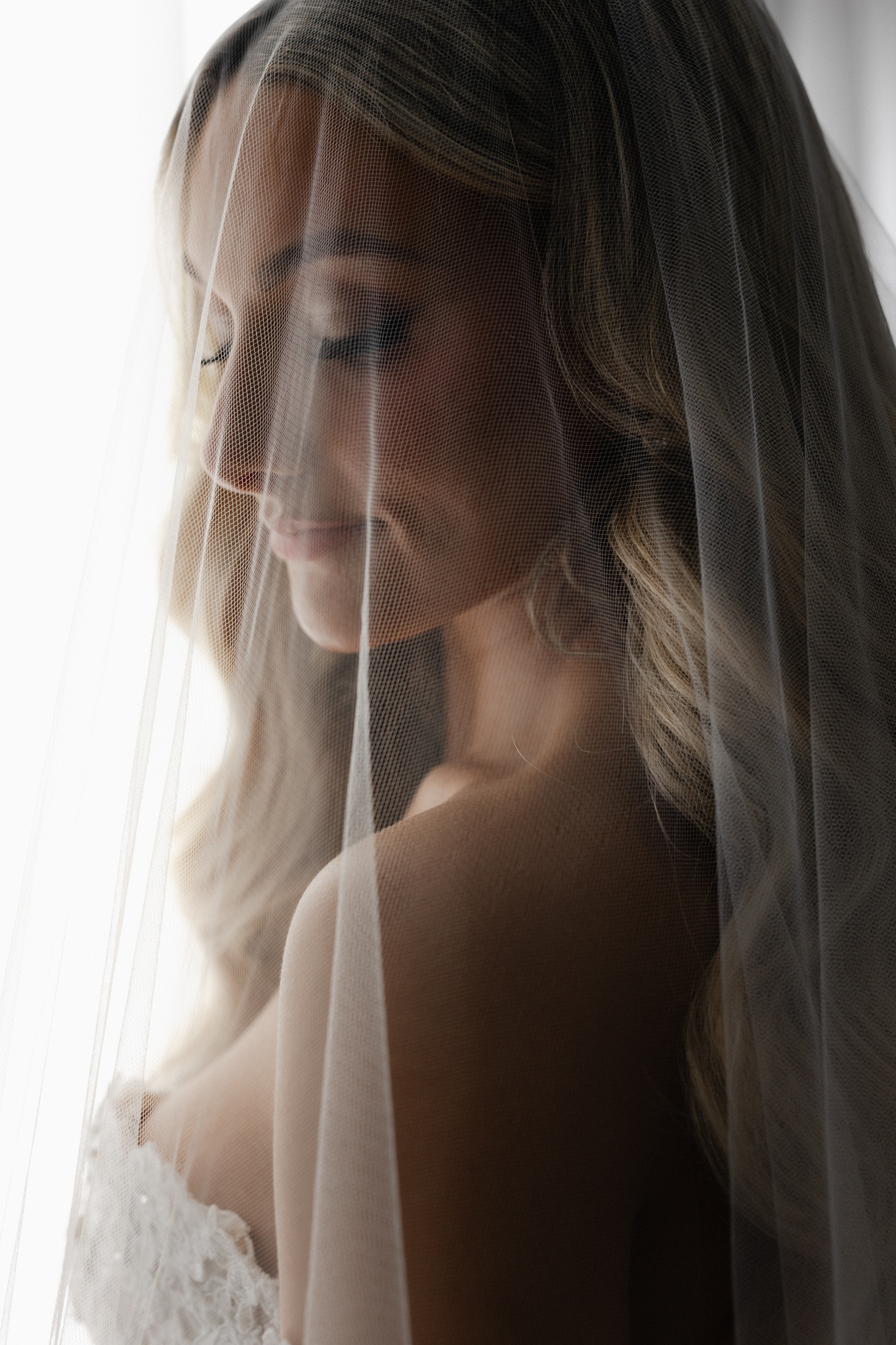 Bride on wedding morning in natural light, captured by Toronto luxury wedding photographer